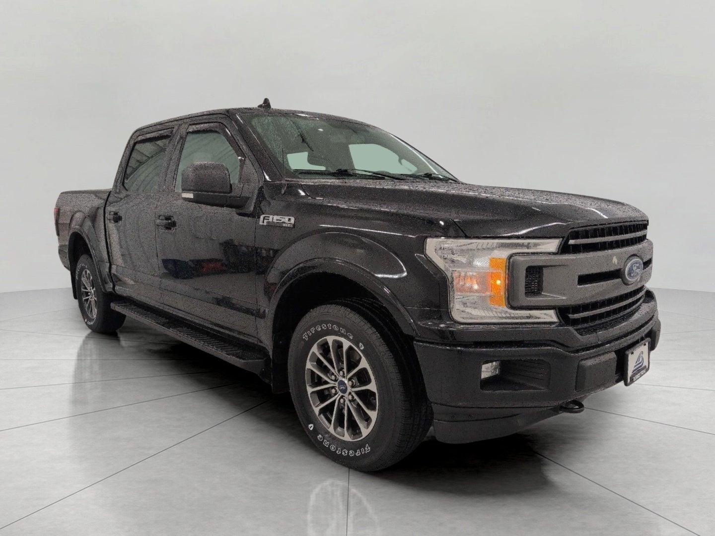 2018 Ford F-150 XLT in Shadow Black — front three-quarter view