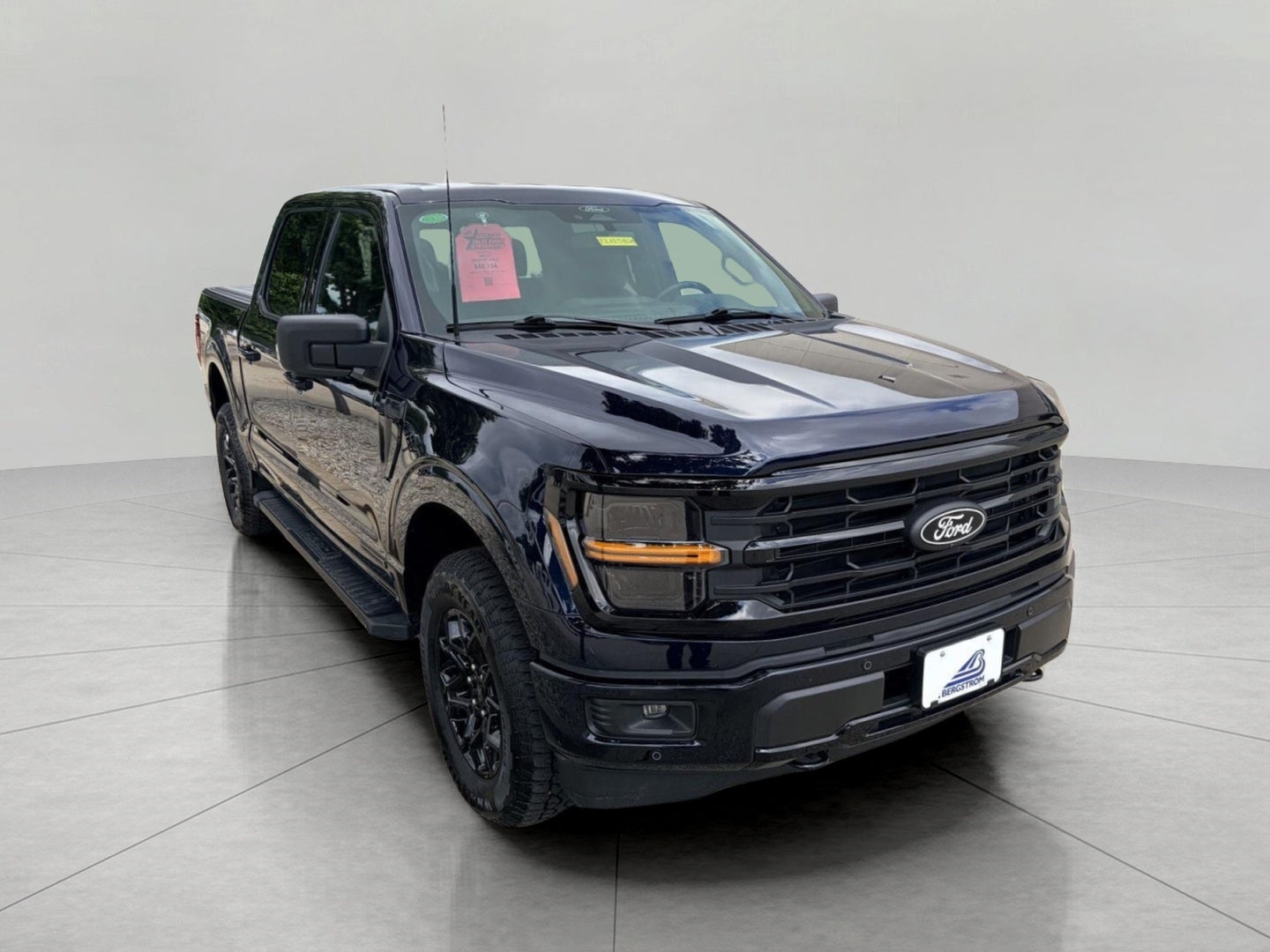 2024 Ford F-150 XLT 4WD SuperCrew 5.5' Box in Antimatter Blue Metallic — front three-quarter view