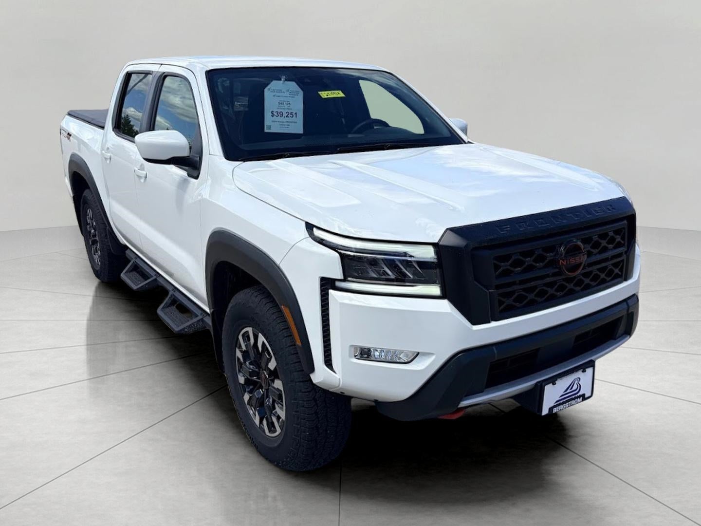 2024 Nissan Frontier Crew Cab 4x4 S in Glacier White — front three-quarter view